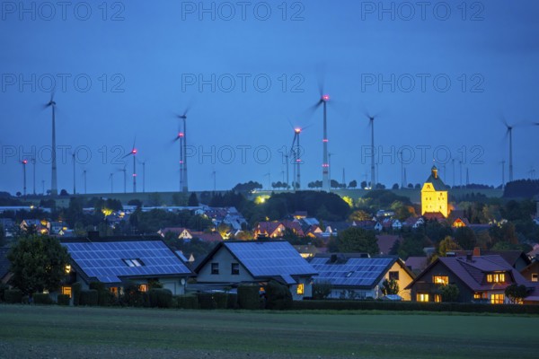 Wind farm above the village of Lichtenau, self-proclaimed energy town, houses with photovoltaic