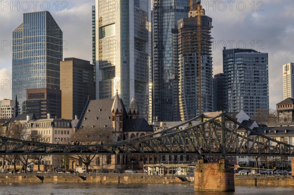 Skyline of the city centre of Frankfurt am Main, river Main, Eiserner Steg bridge, dusk, Hesse,
