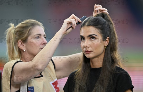 Make-up artist fixes the hair of TV presenter Lea Wagner, portrait, Voith Arena, Heidenheim,