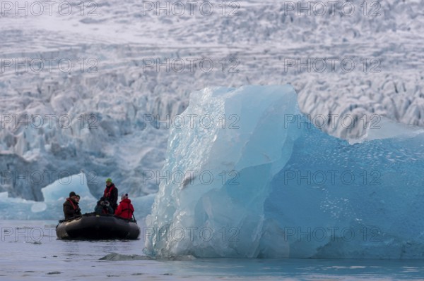Dinghy with tourists in front of the glacier edge of Monacobreen, iceberg, Liefdefjord, Woodfjord