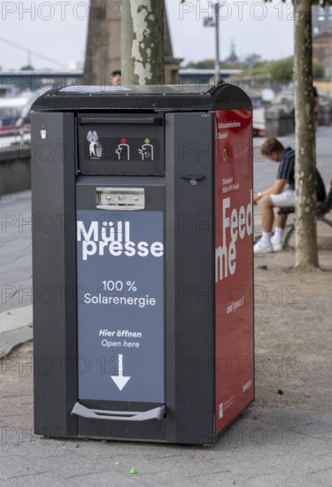 Waste compactor, waste bin in public spaces, here on the banks of the old town in Düsseldorf, the