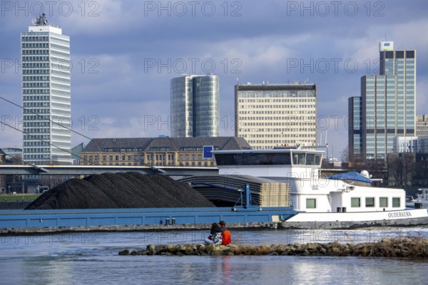 The Rhine near Düsseldorf, cargo ship, coal freighter, skyline, Rhine knee bridge, North