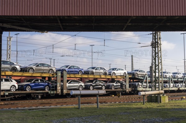 Car train, goods train on its way to the car terminal in Bremerhaven seaport, new German cars for