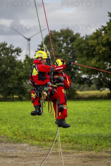 Height rescuers from the Gelsenkirchen fire brigade practise abseiling from a wind turbine from a