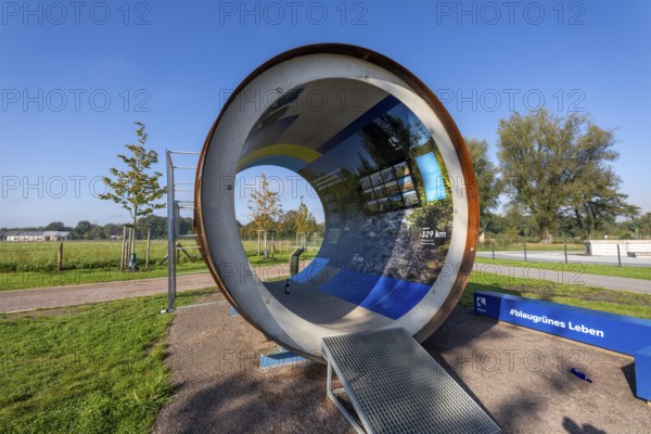 Original sewer pipe element of the Emscher sewer as an information stand in Emscherland, a new