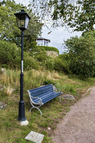 Bench and lantern in the famous allotment garden colony of Brändaholm on the island of Dragsö in