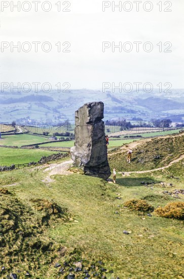 People climbing Alport Stone, Alport Heights, Wirksworth, Peak District National Park, Derbyshire,
