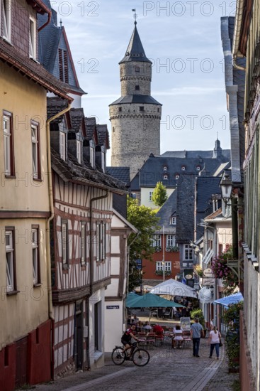 Obergasse with alleyway restaurant, witch tower keep at the back, butter barrel tower, historic old