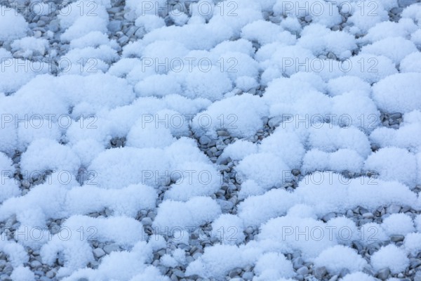 Isar valley in winter at temperatures of minus 18 degrees Celsius. Snow covered landscape with the