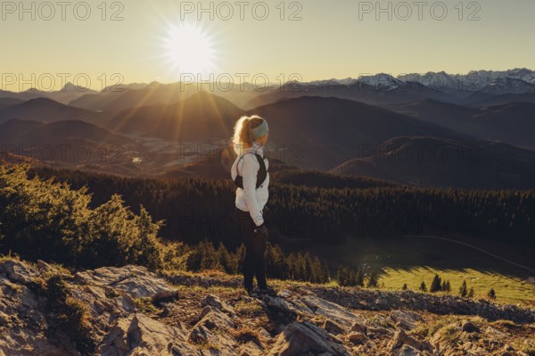 Trail running in autumn on the Jochberg on Lake Walchensee against the wonderful backdrop of the