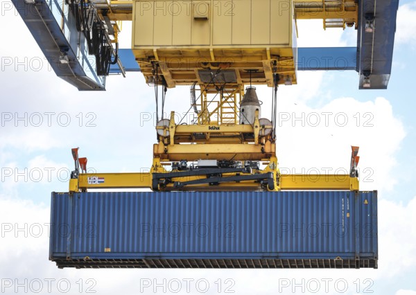 Duisburg, North Rhine-Westphalia, Germany, containers are loaded onto a goods train in the port of