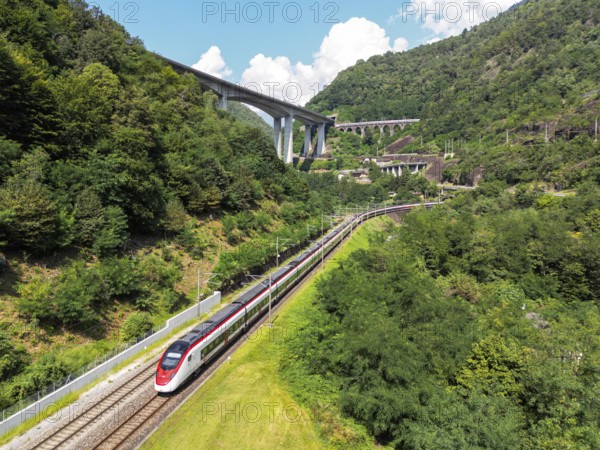 Railway passenger train of the type Stadler Flirt of the Südostbahn on the Gotthard railway Aerial