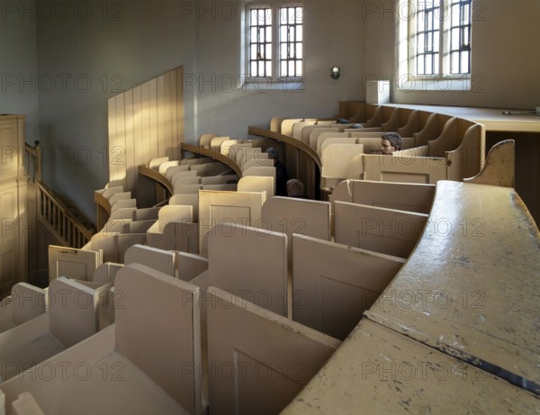 Wooden stalls interior of prison chapel Victorian jail museum, Lincoln Castle, city of Lincoln,