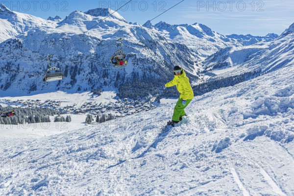 Snowboarders in the Lech Zürs ski resort near Lech, Austria, Europe