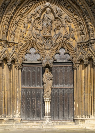 Statue of Mary and baby Jesus in doorway, The Judgement Porch, Lincoln Cathedral, Lincoln,