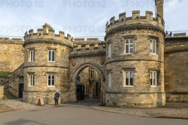 Entrance gateway to Lincoln castle, city of Lincoln, Lincolnshire, England, UK people walking on