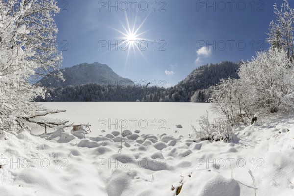 Freibergsee in winter, near Oberstdorf, behind it the Himmelschrofen, 1791m, and the Heini-Klopfer