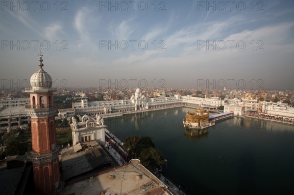 Aerial view of city and Harmandir Sahib or Darbar Sahib or Golden temple and Tower of Ramgarhia