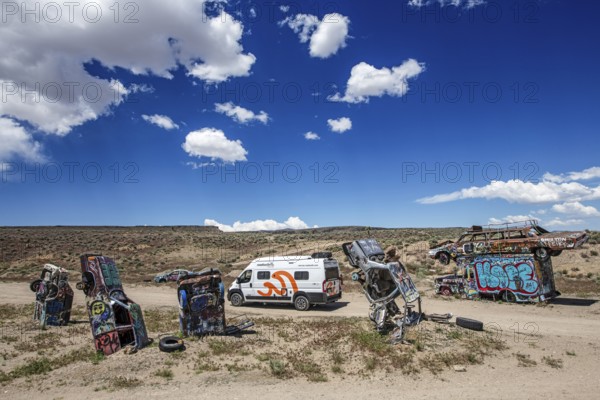 Motorhome and scrap cars decorated with graffiti in the Carforest of Goldfield, Nevada, USA, North