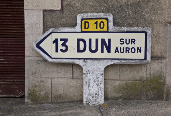Historic ceramic and concrete signpost, D 10 13 DUN SUR AURON