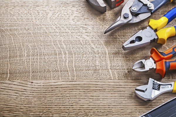 Composition of construction tools on wooden board copy space