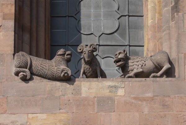 Worms, St Peter's Cathedral, east choir, figures under the large windows: lions and rams