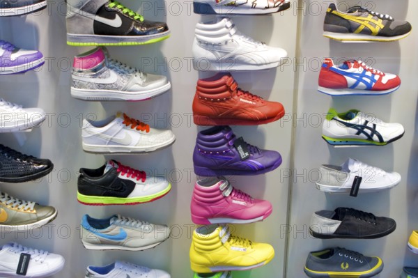 Colourful decorative shoes for sale in store, London, UK United Kingdom England