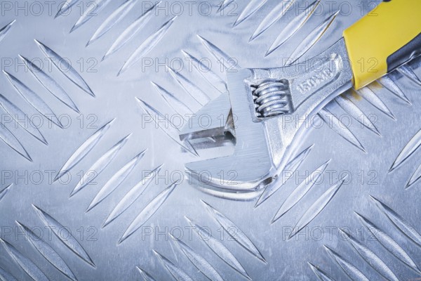 Adjustable tensioner on corrugated metal plate construction concept