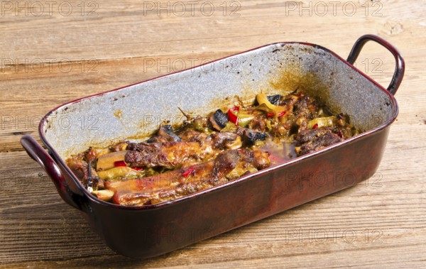 Roasted ribs in old frying pan