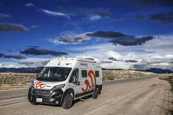 Motorhomes in the midst of wild thunderstorms and rain clouds, on the Great Basin Highway US 93,