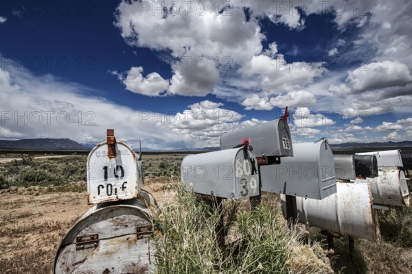 Letterboxes, mailboxes, cumulus clouds Highway 50, Loneliest Road in America, Ely, Nevada, USA,
