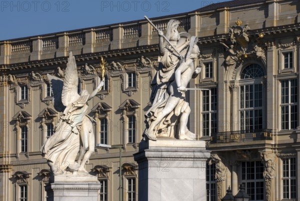 Berlin, Humboldt Forum in the Berlin Palace, in front of figures on the Palace Bridge