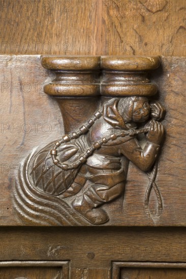 Choir stalls, drolleries on the stall sides with proverbial depictions, 1493 by Johannes Gruter