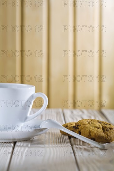 Ceramic coffee cup and cookies