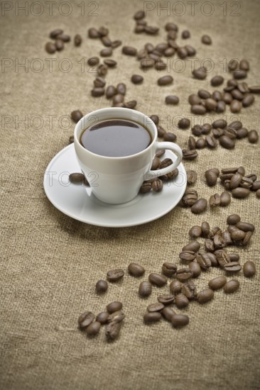 Coffee grains and cup of coffee