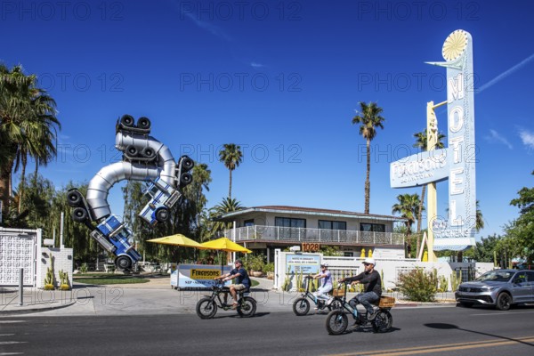 Cyclist in front of truck artwork, Fergusons Motel, Las Vegas, Nevada, USA, North America