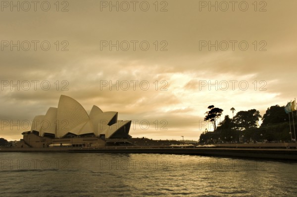 Sydney Opera Theatre at late evening with dramatic sky, Sydney, New South Wales, Australia, Oceania