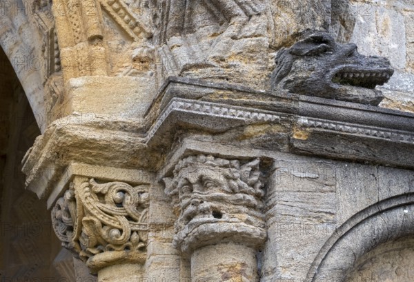 Sherborne Abbey, south doorway, battle zone, capital with leaf mask and monster