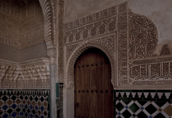 Nasrid Palace, wall design around a door with stucco framing and tiled plinth