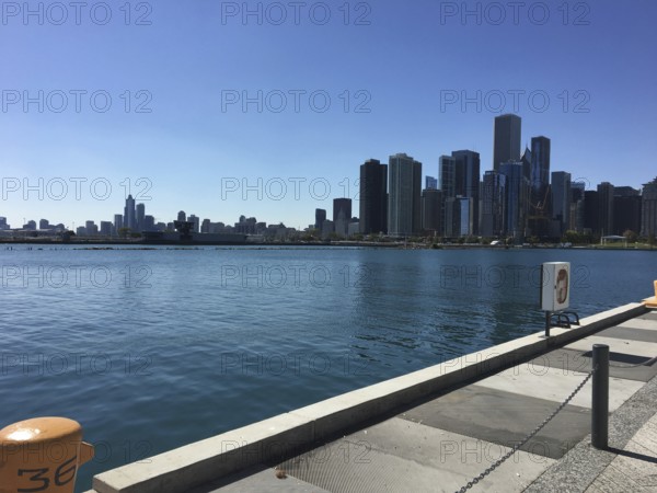 Panorama of waterfront skyline with calm lake and blue sky, chicago, illinois, usa