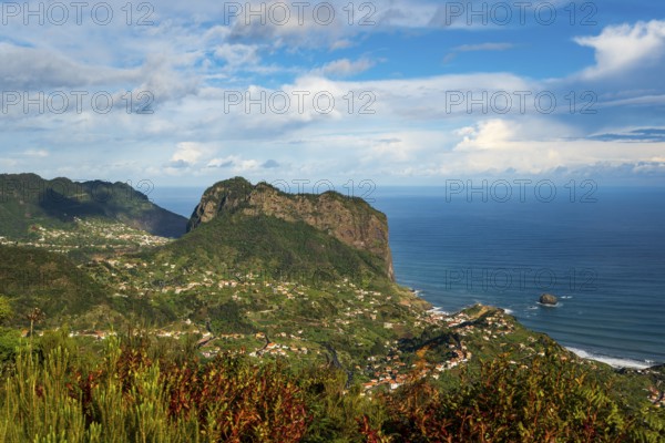 View of the Penha d'Águia (Eagle Rock) and the surrounding coastal landscape with lush greenery and