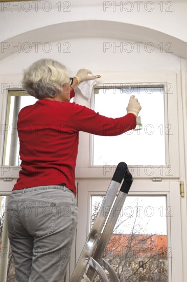 Cleaning flat windows, Germany, Europe