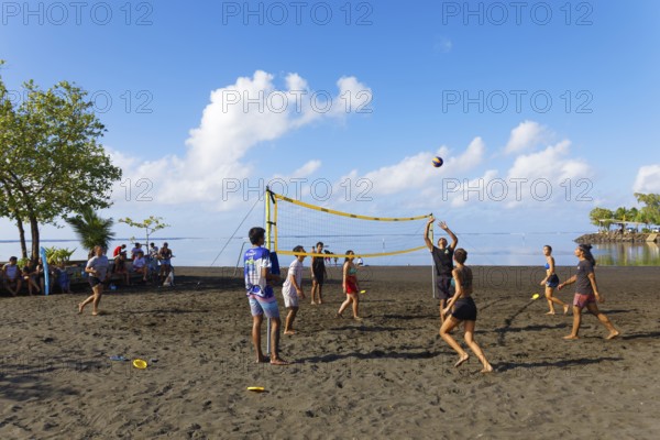 Young people playing volleyball on the beach, black, sand, Matavai Bay, Pointe Venus, Mahina