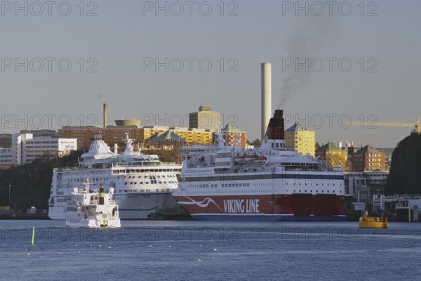 Ferries to Finland and the Baltic States in the harbour with industrial backdrop, Stockholm,