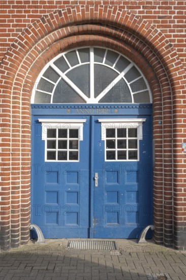 View of an entrance area of an old town house, street photography, double wing door, entrance door,