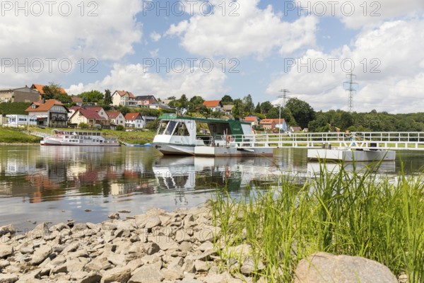 Ferryboat Stolzenfels at the pier in Diesbar-Seußlitz on the banks of the Elbe, in the background