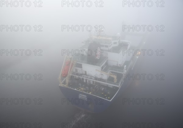 Cargo ship JAMNO sailing in fog in the Kiel Canal, NOK, Kielkanal, Kiel Canal, Schleswig-Holstein,