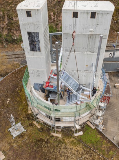 Close-up of a construction site with two large concrete towers and construction work, extension of