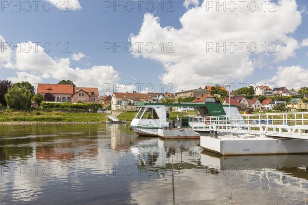 Ferryboat Stolzenfels at the pier in Diesbar-Seußlitz on the banks of the Elbe, in the background