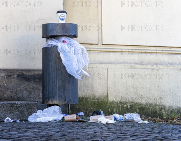 Overfilled rubbish bin in the public street, Berlin, Germany, Europe
